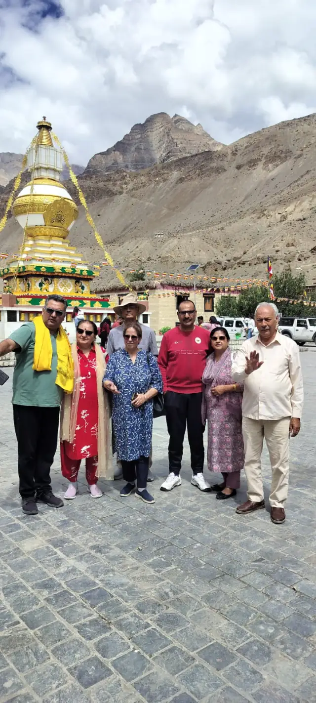 A group of our guests together on a trip, in front of a Buddhist stupa